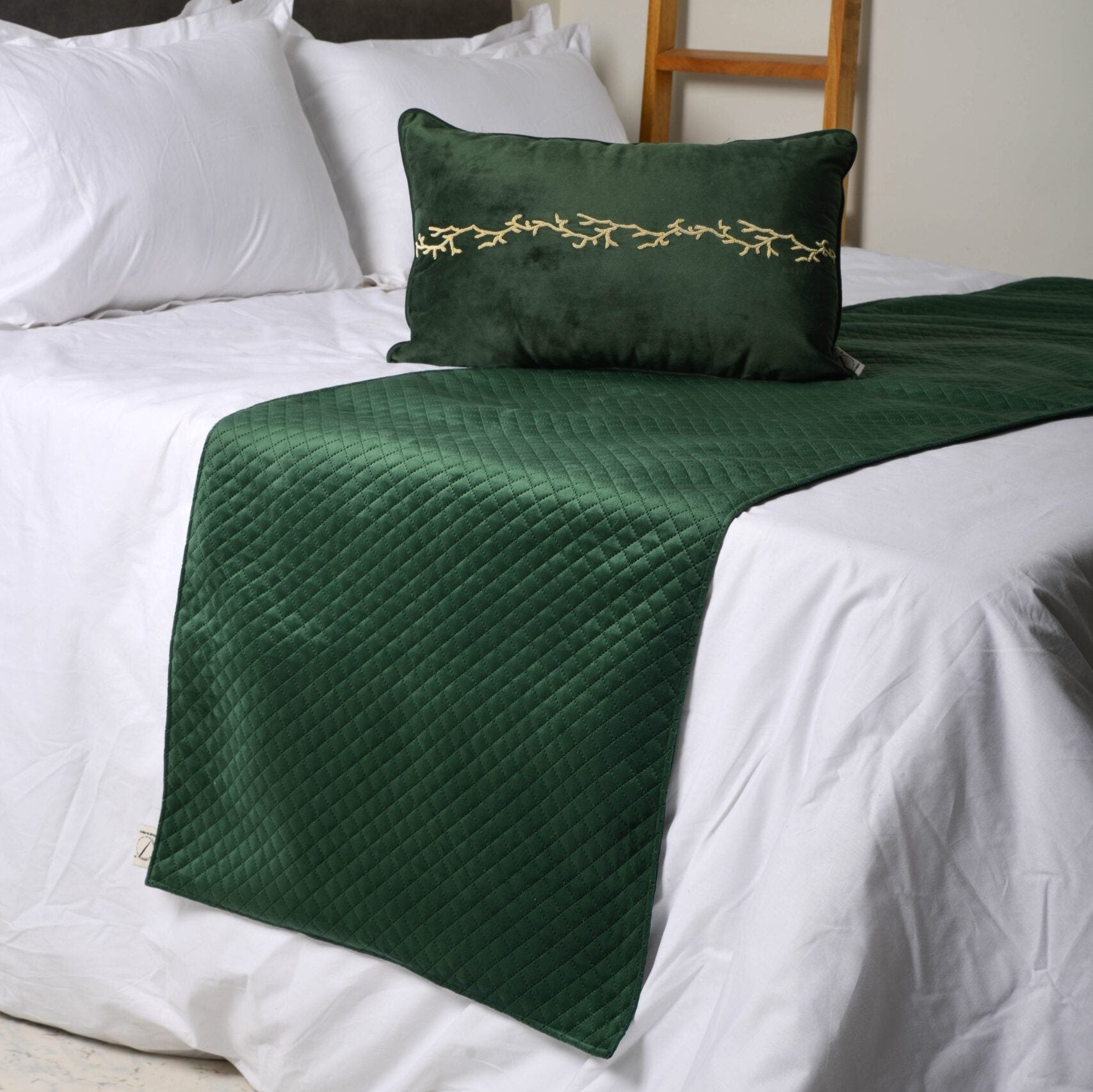 t cushion cover with beaPhotoshoot of cushion cover in a room.Green velvet cushion cover with golden embroidery.